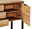 Detailansicht eines Sideboards aus Holz mit geöffneter Tür und Schubladen, aus der rechten Perspektive.