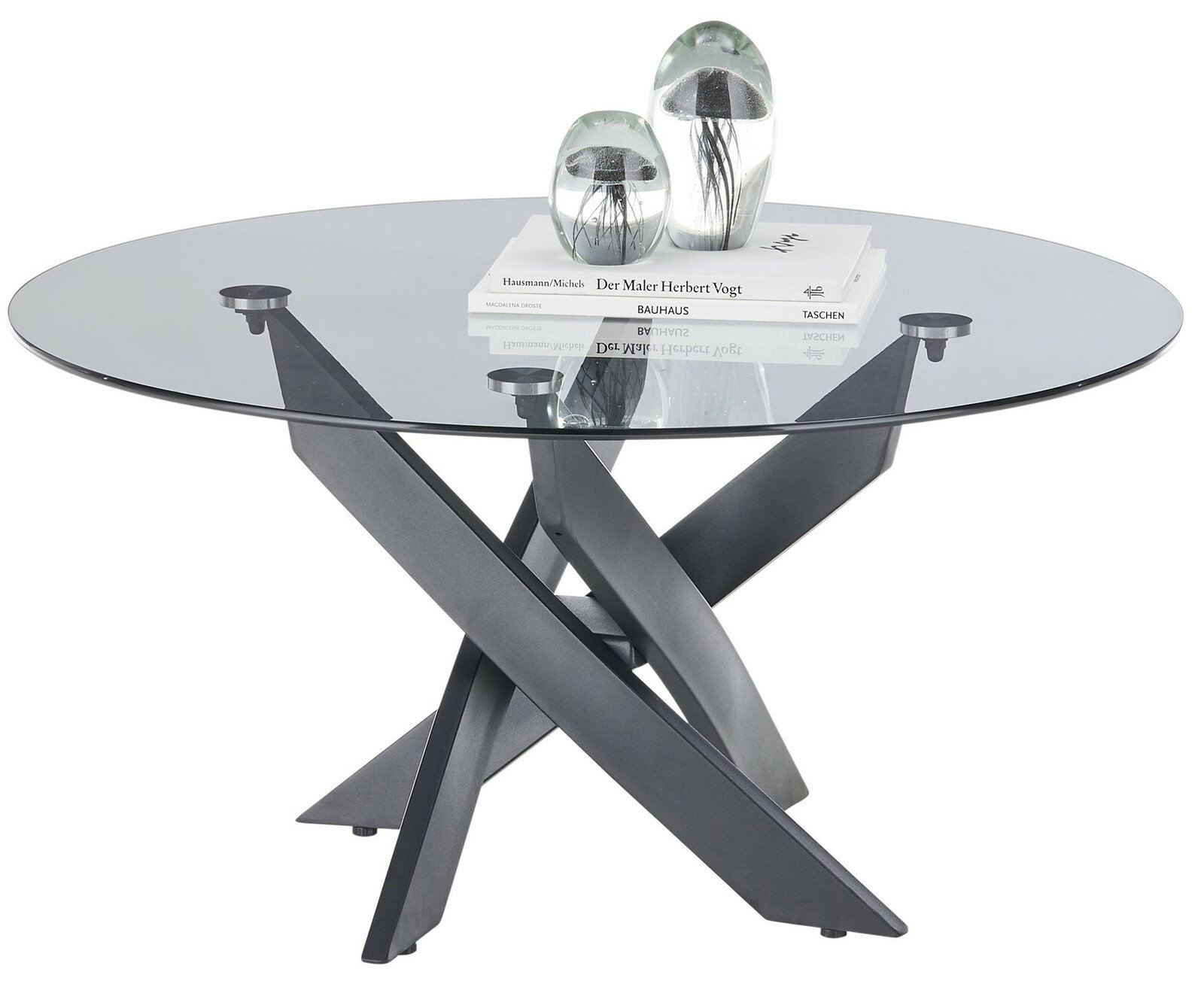 Runder Couchtisch mit Glasplatte und modernem, überkreuztem Metallgestell, seitliche Perspektive