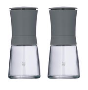 Zwei graue Mühlen aus Glas und Metall, frontal fotografiert, mit modernem Design.