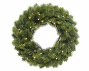 Grüner Weihnachtskranz mit integrierten Lichtern, von vorne betrachtet.