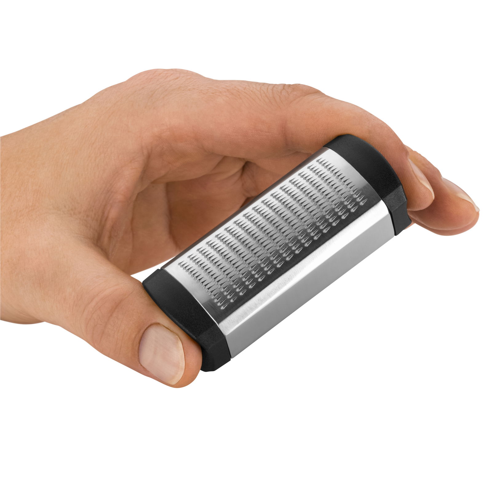 Muskatreibe in der Hand gehalten, seitliche Perspektive