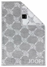 Graues Gästetuch mit geometrischem Muster und JOOP!-Logo, von oben fotografiert.