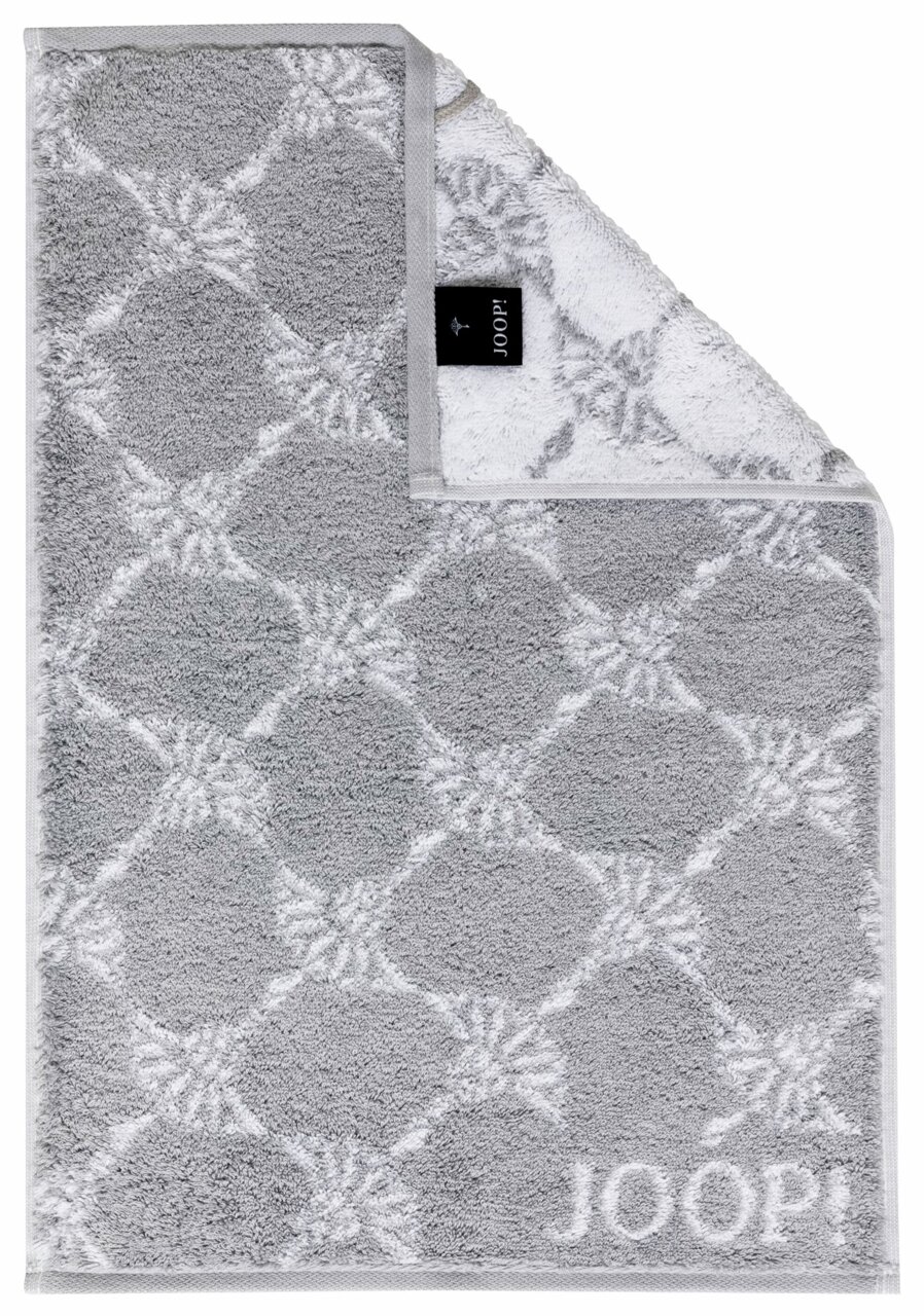JOOP! Handtuch CORNFLOWER CLASSIC Graues Gästetuch mit geometrischem Muster und JOOP!-Logo, von oben fotografiert.