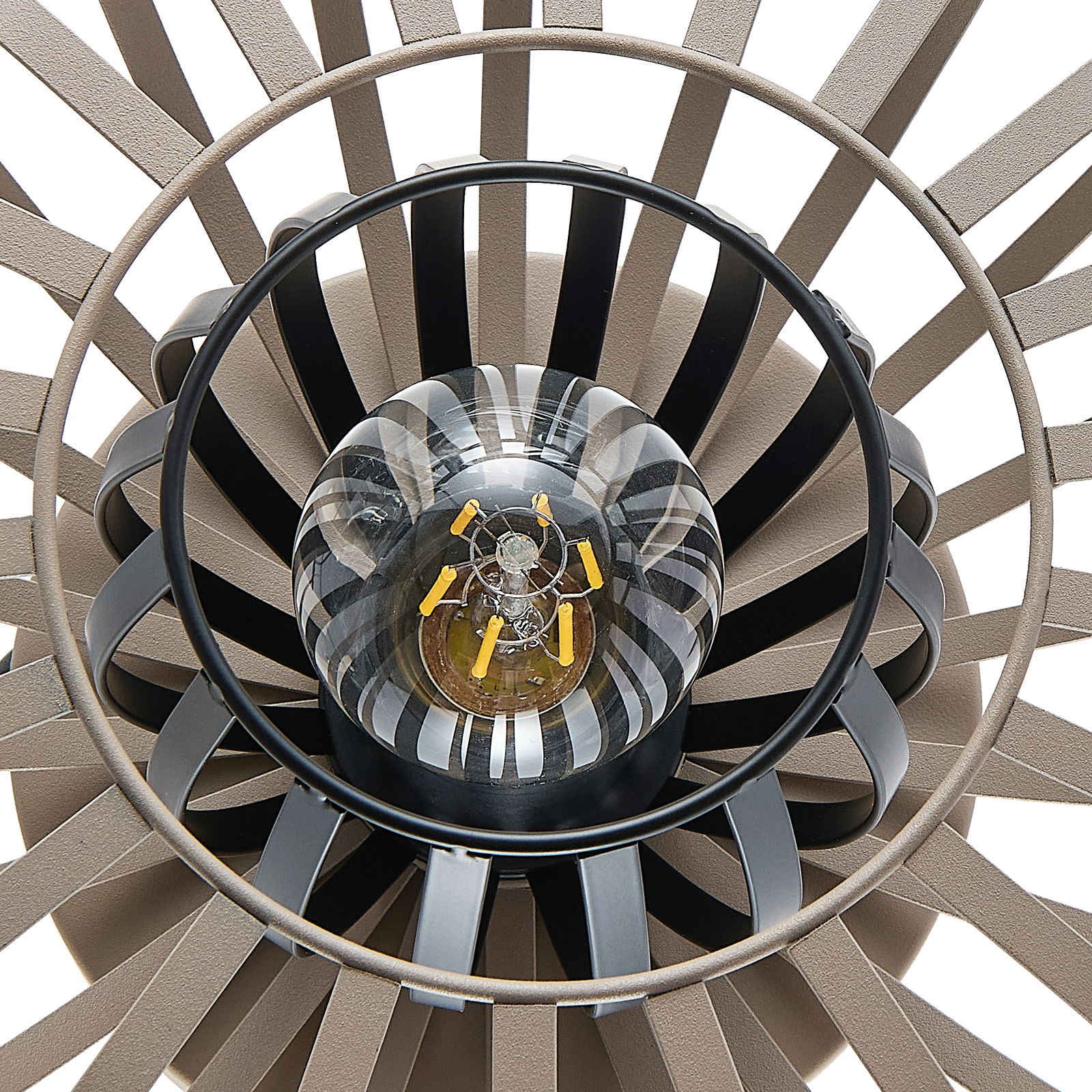 Nahaufnahme einer Tischleuchte von oben, die das Design mit konzentrischen Kreisen und einer zentralen Glühbirne zeigt.