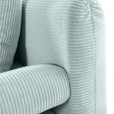 Nahaufnahme eines hellgrünen Funktionssofas mit geripptem Stoffbezug, Perspektive von der Seite