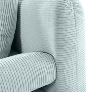 Nahaufnahme eines hellgrünen Funktionssofas mit geripptem Stoffbezug, Perspektive von der Seite