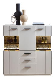Frontale Ansicht des Highboards COMO von Zurbrüggen mit dekorativen Vasen und Beleuchtung.