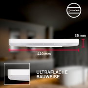 Ultraplatte ronde LED-plafondlamp in wit met matte diffuser, diameter 420 mm en hoogte 35 mm, zijaanzicht op product