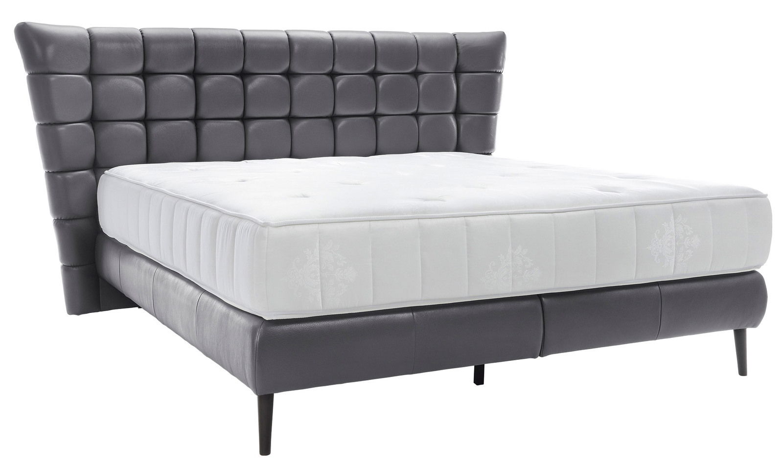 Boxbett mit gepolstertem Kopfteil in dunklem Leder und weißer Matratze, seitliche Perspektive