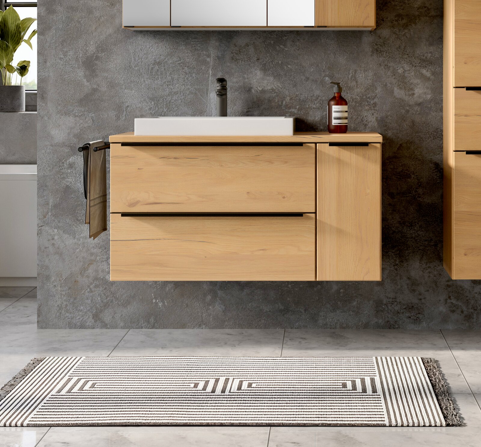 Modernes, wandhängendes Badezimmer-Waschbecken mit Holz-Unterschrank und zwei Schubladen, weißem Aufsatzwaschbecken und schwarzer Armatur vor grauer Betonoptik-Wand, Frontansicht auf Augenhöhe.