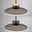 Moderne Pendelleuchte PURE Moon in seitlicher Perspektive mit elegantem, flachem Schirm und warmem Licht.