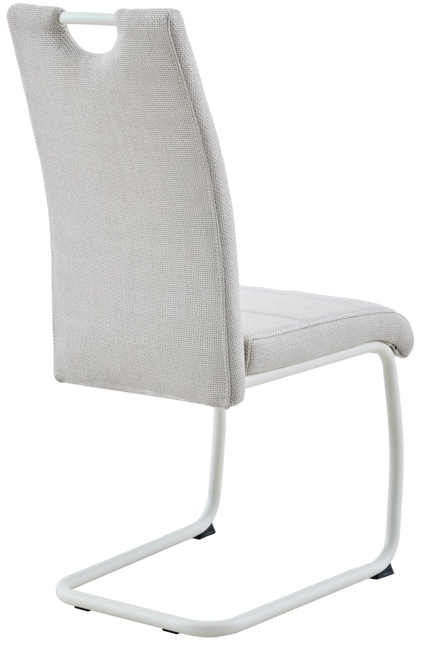 Gepolsterter Freischwinger-Stuhl in Hellgrau mit weißem Metallgestell und Griffausschnitt an der Rückenlehne, Ansicht schräg von hinten links