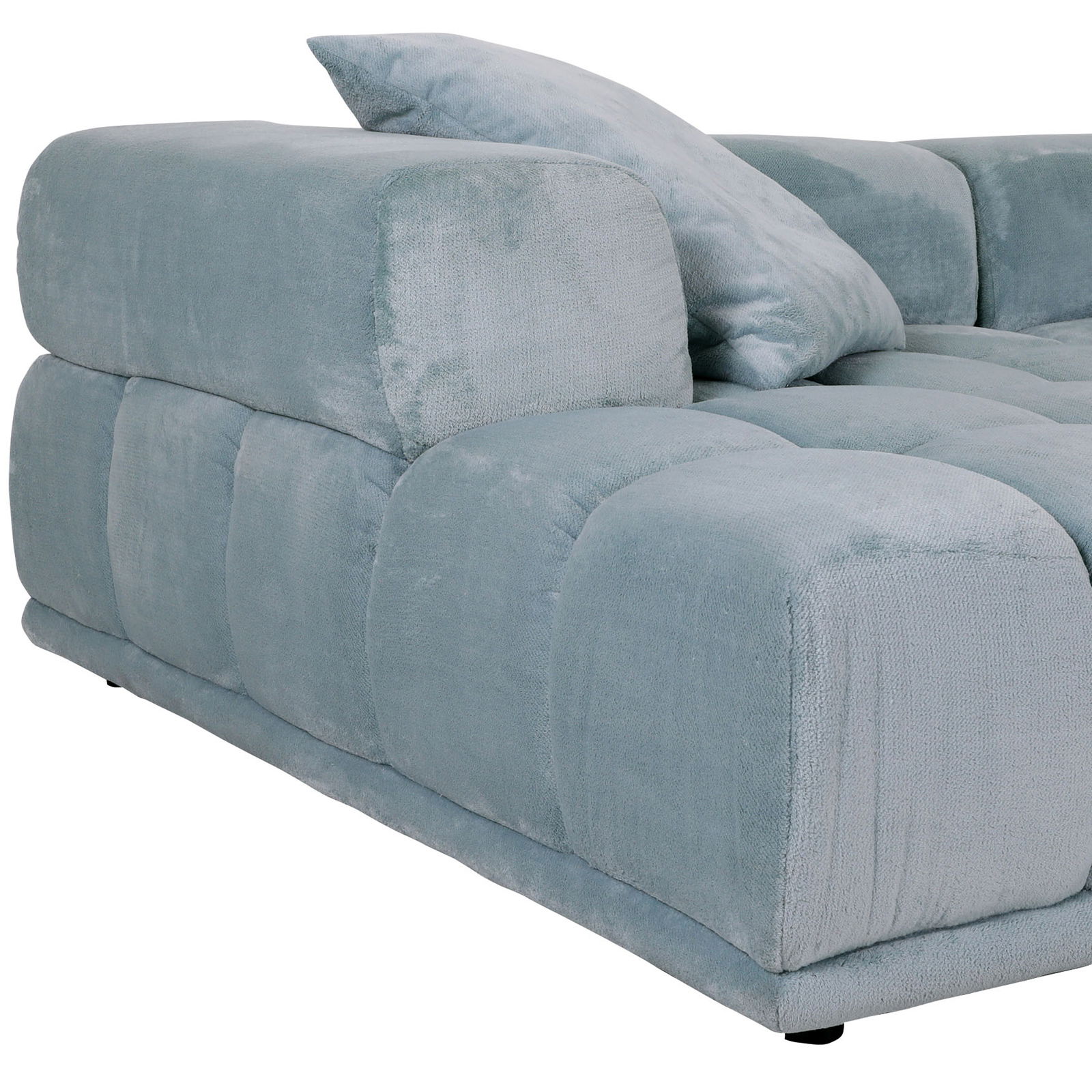 Großes, modernes Big-Sofa in hellblauem Stoffbezug, seitliche Perspektive mit Kissen.