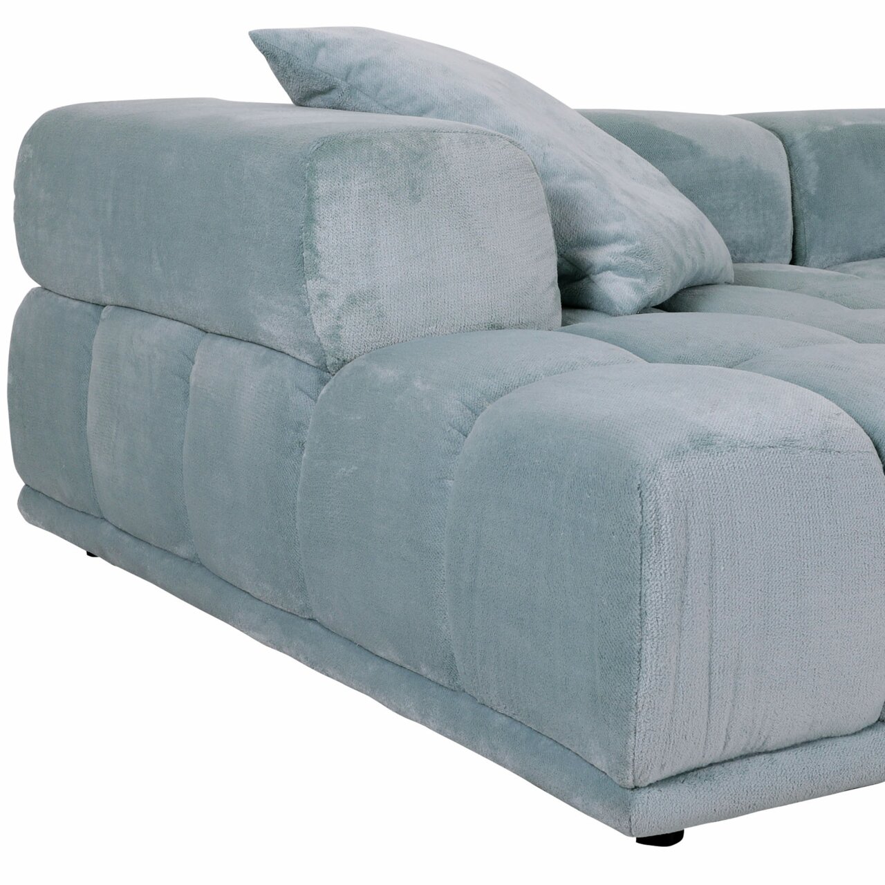 Großes, modernes Big-Sofa in hellblauem Stoffbezug, seitliche Perspektive mit Kissen.