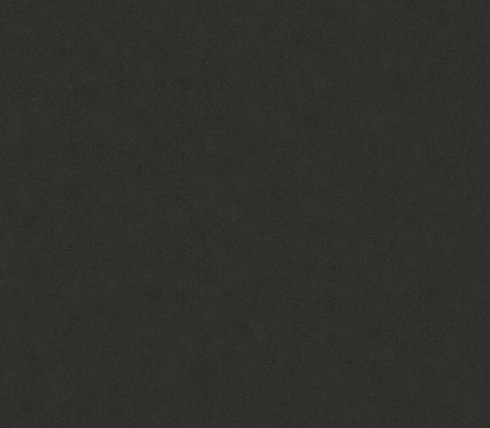 Nahaufnahme eines gepolsterten Kopfteils in schwarzer Lederoptik, Textur sichtbar