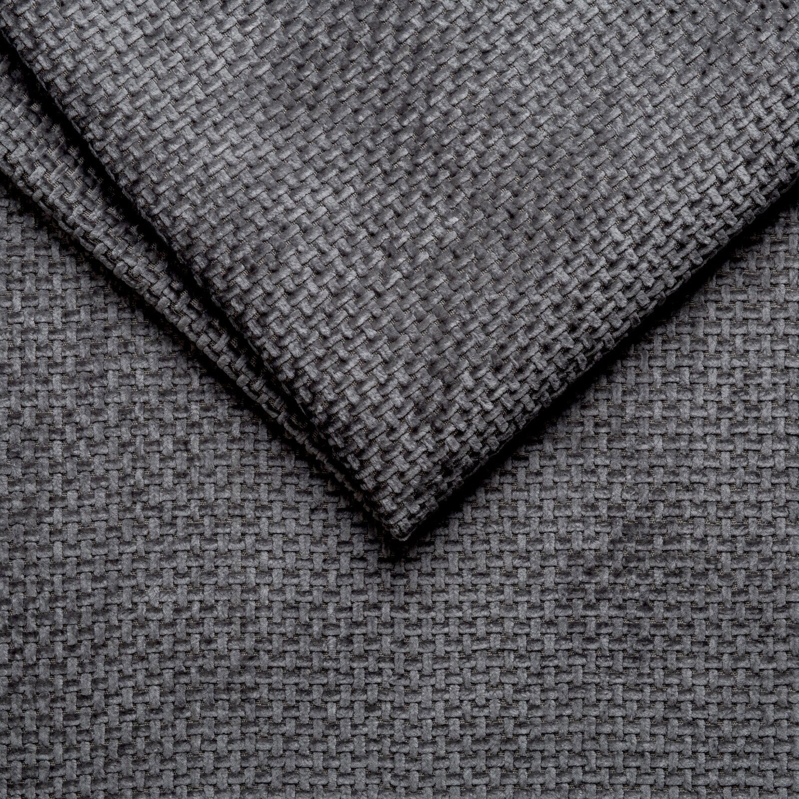 Nahaufnahme eines grauen, strukturierten Stoffes, der für ein Polsterbettgestell verwendet wird.