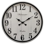 Runde Wanduhr mit großen schwarzen Ziffern und Zeigern auf weißem Hintergrund, frontal abgebildet.