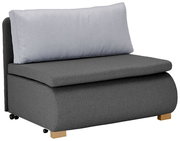 Grauer Funktionssessel mit hellgrauem Rückenkissen, seitliche Perspektive