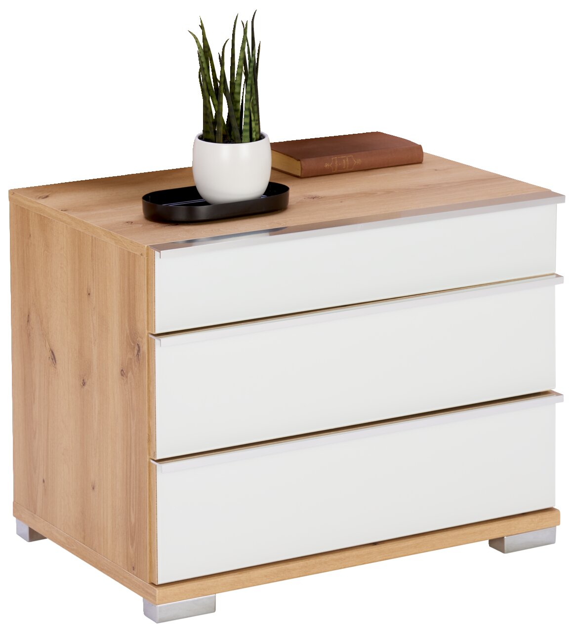 Nachtkastje met drie lades in houtlook en witte fronten, versierd met een plant en een boek, zijaanzicht