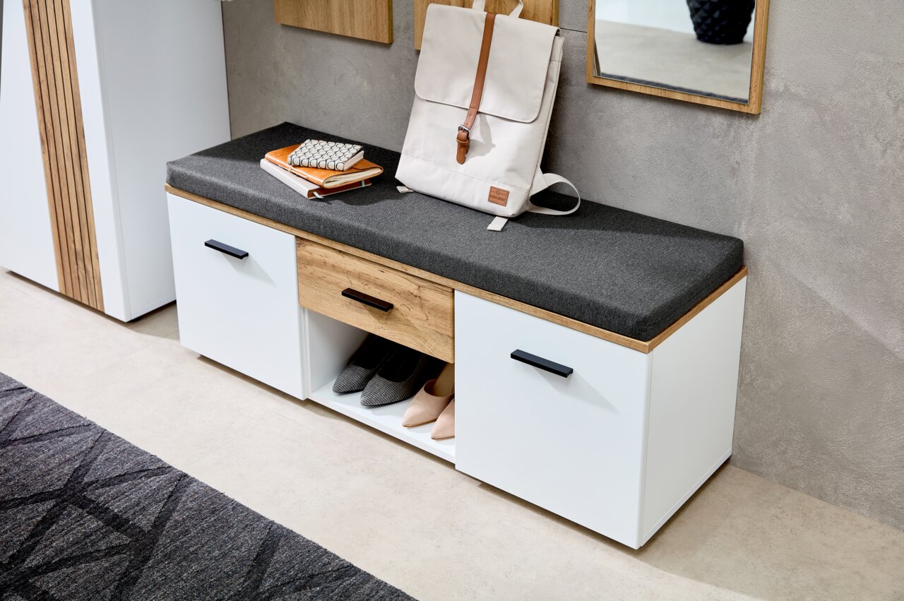 XORA Garderobenbank SPARKS Garderobenbank mit weißem Korpus, grauem Sitzpolster und Holzschublade, seitliche Perspektive