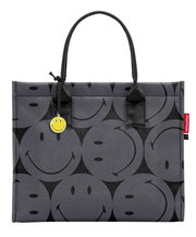 Graue Einkaufstasche mit schwarzen Smiley-Motiven und gelbem Smiley-Anhänger, Vorderansicht