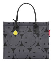 Graue Einkaufstasche mit schwarzen Smiley-Motiven und gelbem Smiley-Anhänger, Vorderansicht