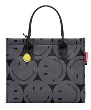 Grijze boodschappentas met zwarte smiley-motieven en een gele smiley-hanger, vooraanzicht