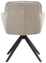 Rückansicht eines Armlehnstuhls mit beigem Stoffbezug und schwarzen Metallbeinen.