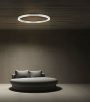 Moderne Deckenleuchte PURE-LINES von Paul Neuhaus, kreisförmig und minimalistisch, an der Decke eines stilvollen Raumes montiert, mit Blick von unten.