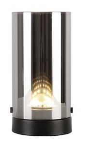 Zylindrische LED-Tischleuchte mit transparentem Glas und schwarzem Sockel, frontal betrachtet.