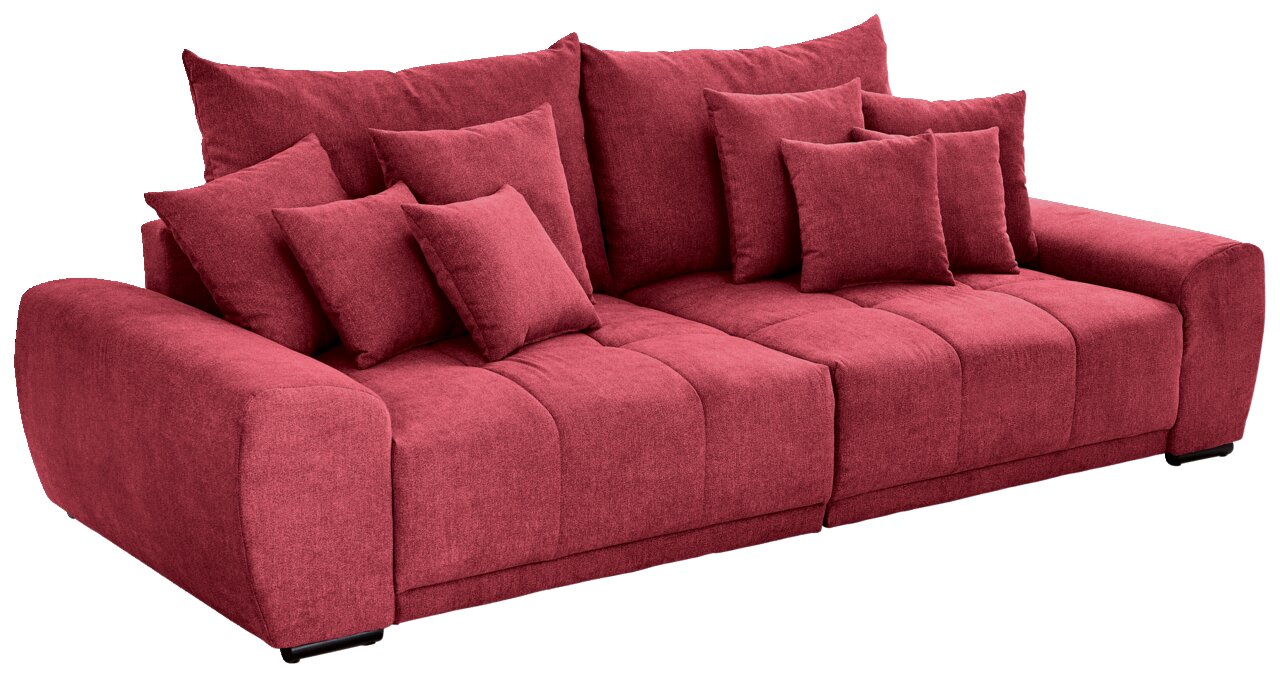 Großes rotes Sofa mit mehreren Kissen, seitliche Perspektive