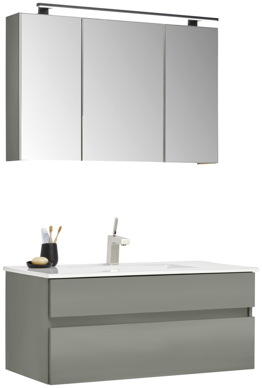 Moderner Badblock mit grauem Unterschrank und Spiegelschrank, seitliche Perspektive