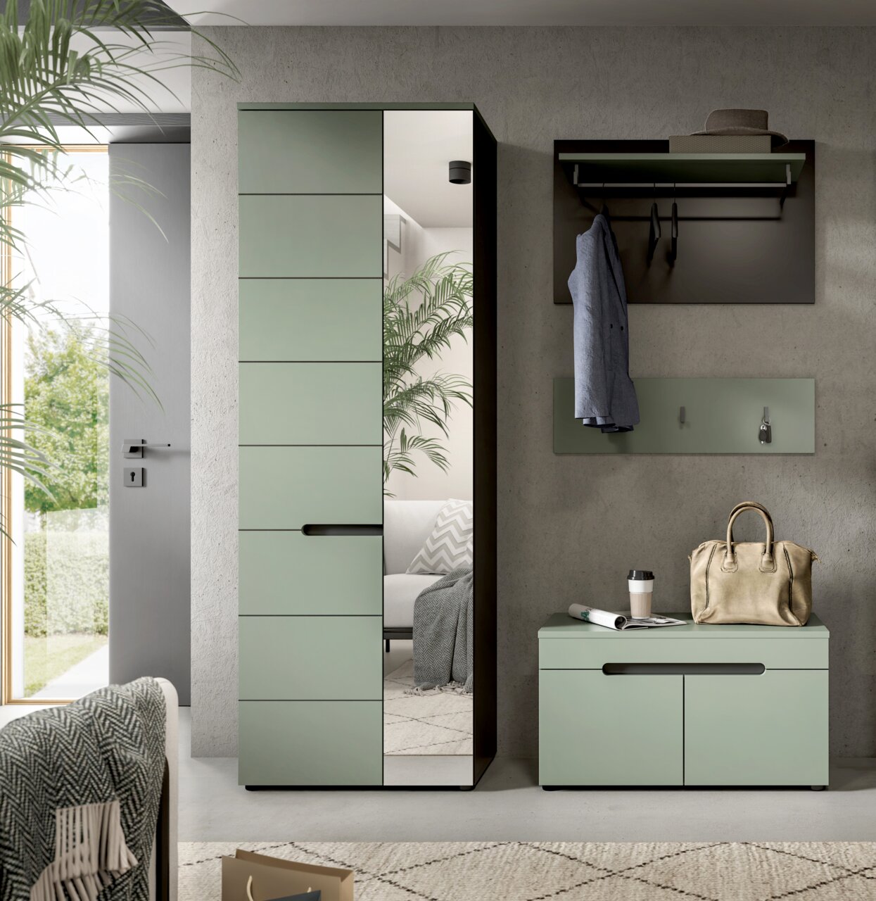 Modernes Garderoben-Set in Salbeigrün mit hoher Schrank-Garderobe (teils Spiegel), Wandpaneel mit Ablage und Haken sowie Sitzbank/Schuhschrank, frontal aus leicht seitlicher Perspektive im Flur inszeniert