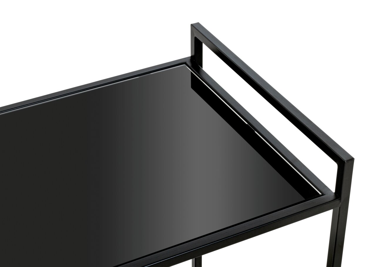 Close-up van een modern zwart bijzettafeltje met glazen blad, gezien van bovenaf.