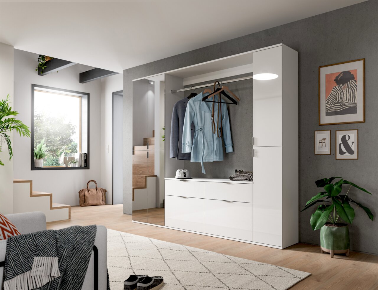 Moderne weiße Kommode in einem stilvollen Wohnzimmer, frontal betrachtet, mit hängender Kleidung und Dekoration.