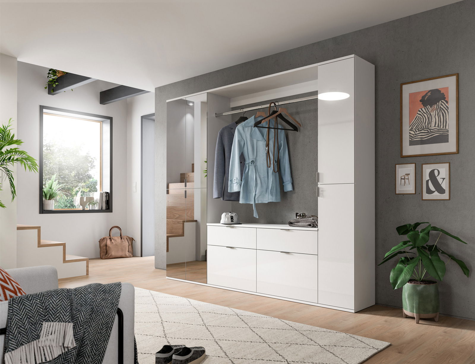 Moderne weiße Kommode in einem stilvollen Wohnzimmer, frontal betrachtet, mit hängender Kleidung und Dekoration.