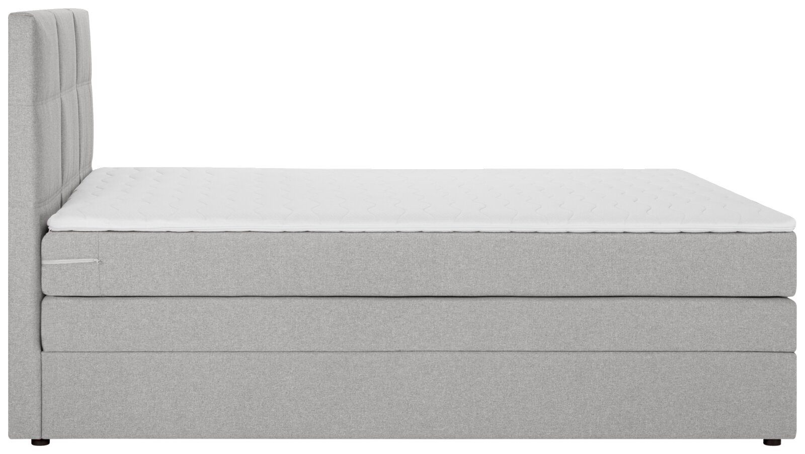 Seitliche Ansicht eines grauen Boxspringbetts mit gepolstertem Kopfteil und weißer Matratze.