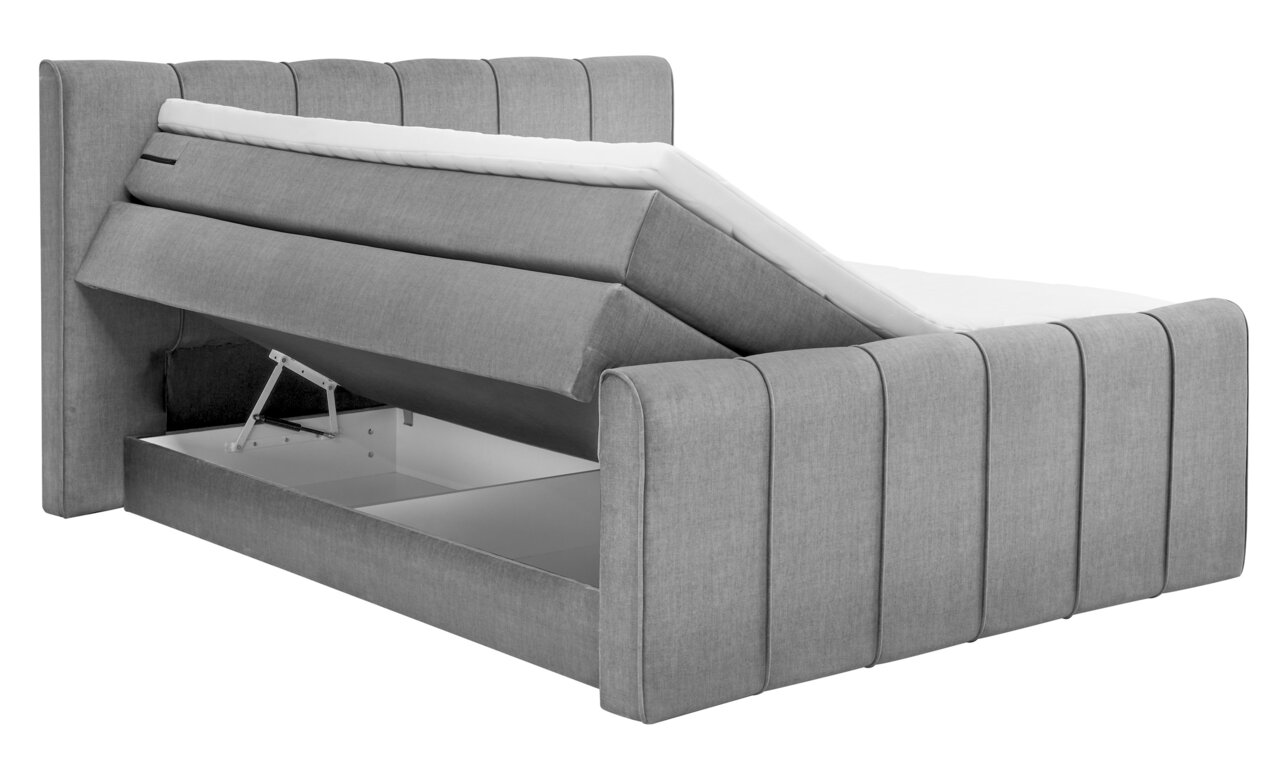 Grijs boxspringbed met opklapbaar matras en zichtbare opbergruimte, zijaanzicht