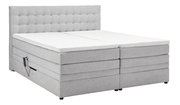 Graues Boxspringbett mit gepolstertem Kopfteil, seitlicher Perspektive