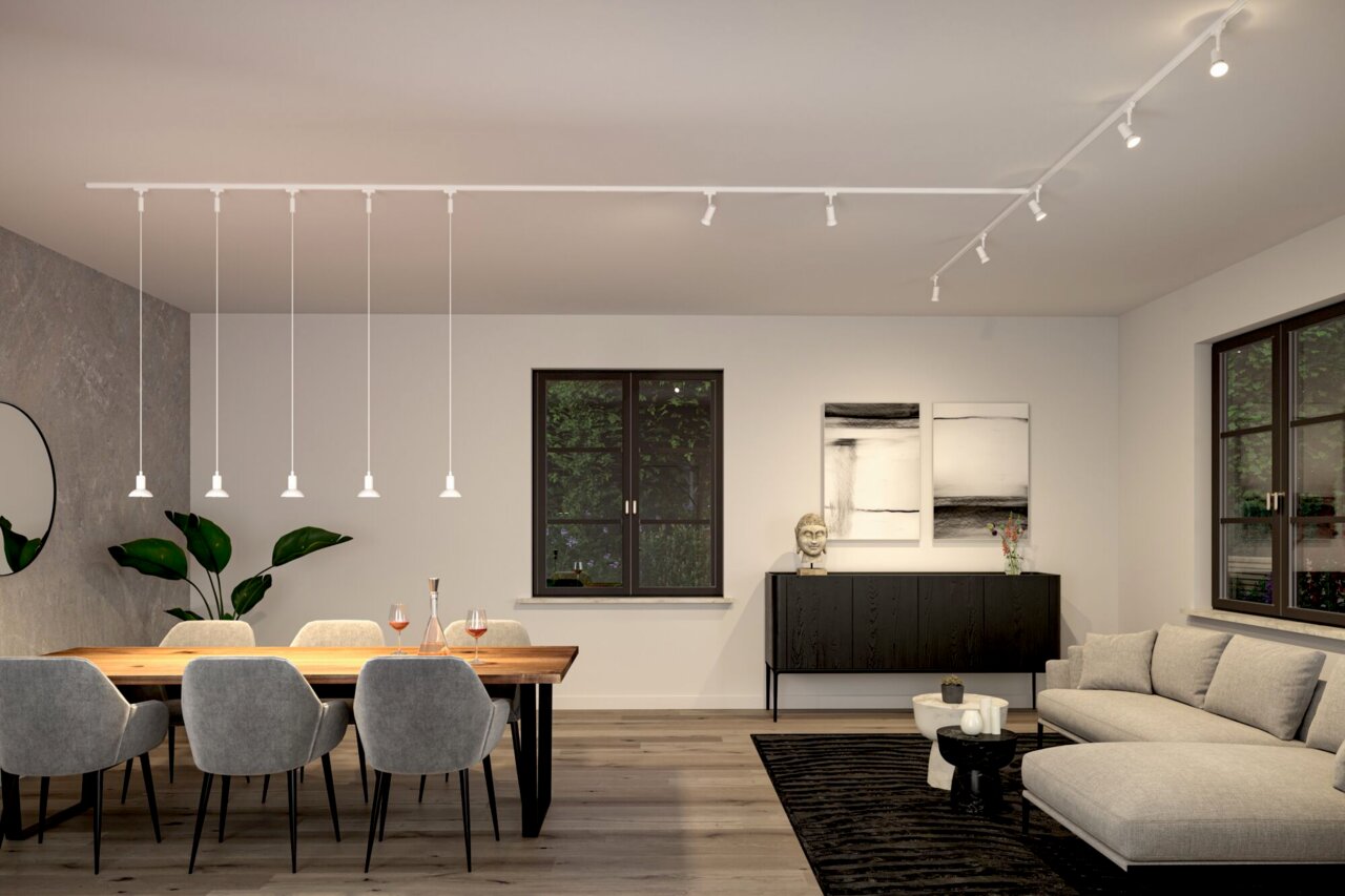 Moderne Schienenpendelleuchte Runa in einem stilvollen Wohnzimmer, seitliche Perspektive.
