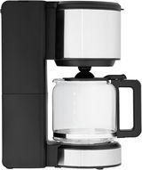 Seitliche Ansicht der WMF STELIO Aroma Kaffeemaschine mit Glaskanne und Edelstahl-Elementen.