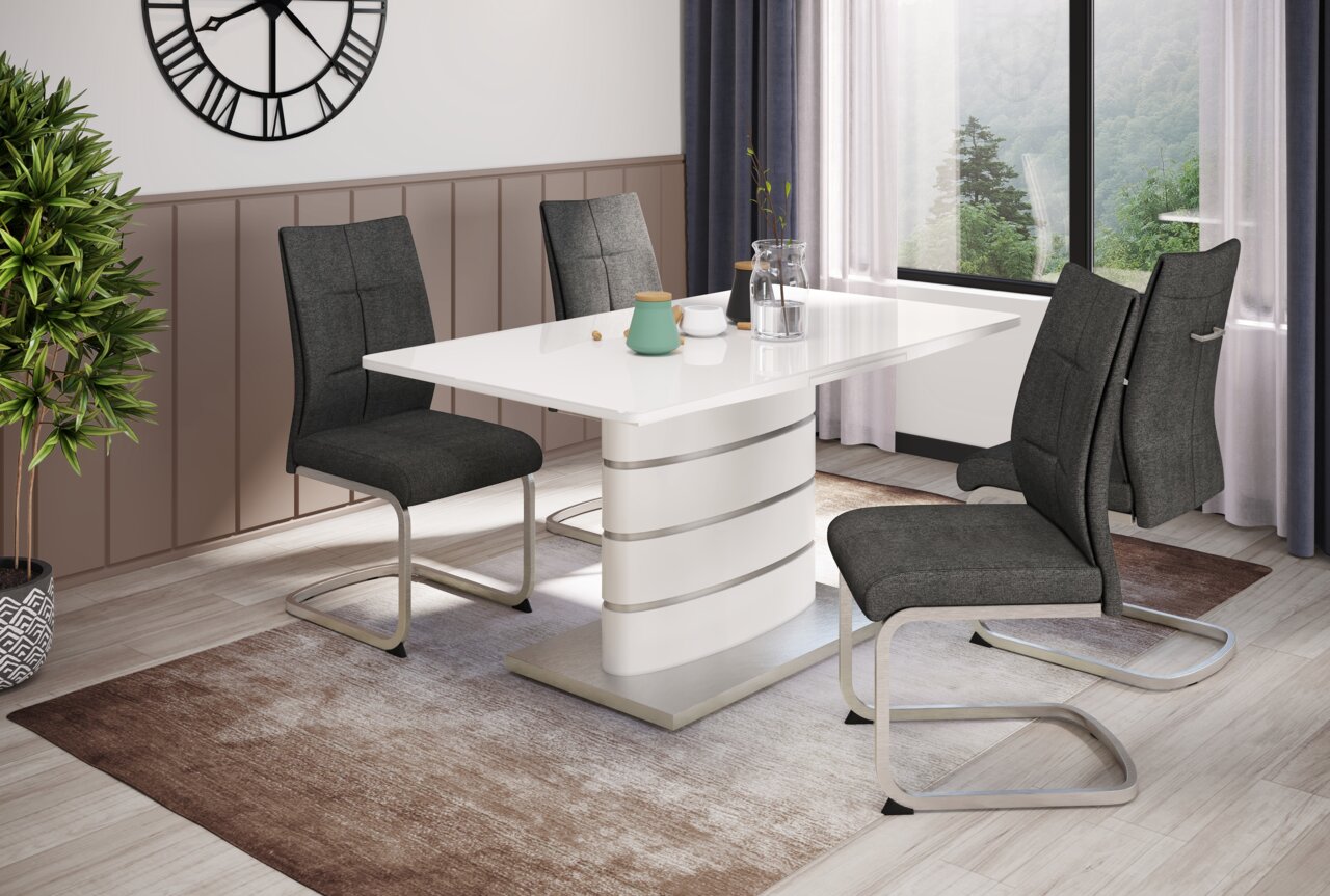 Eetkamer met een moderne witte tafel en vier grijze klapstoelen, zijaanzicht