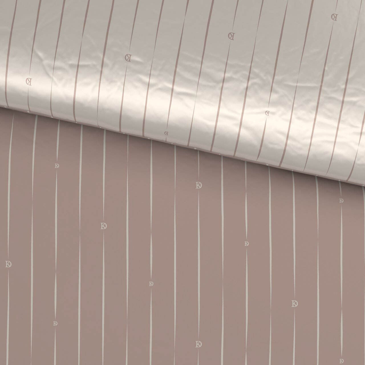 Wendebettwäsche mit beidseitigem Streifenmuster in Beige und Rosa, aus der Vogelperspektive fotografiert.