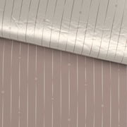 Wendebettwäsche mit beidseitigem Streifenmuster in Beige und Rosa, aus der Vogelperspektive fotografiert.