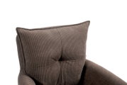 Close-up van een fauteuil met geribbelde stoffen bekleding in bruin, gezien van bovenaf.