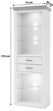 Hohe weiße Vitrine/Regal aus Holzoptik mit grauer Abdeckplatte, Glasböden und integrierter Beleuchtung sowie zwei Schubladen mit Metallgriffen; Maße ca. 210 x 73 x 40 cm, frontal aus leicht schräger Perspektive von vorn gezeigt.