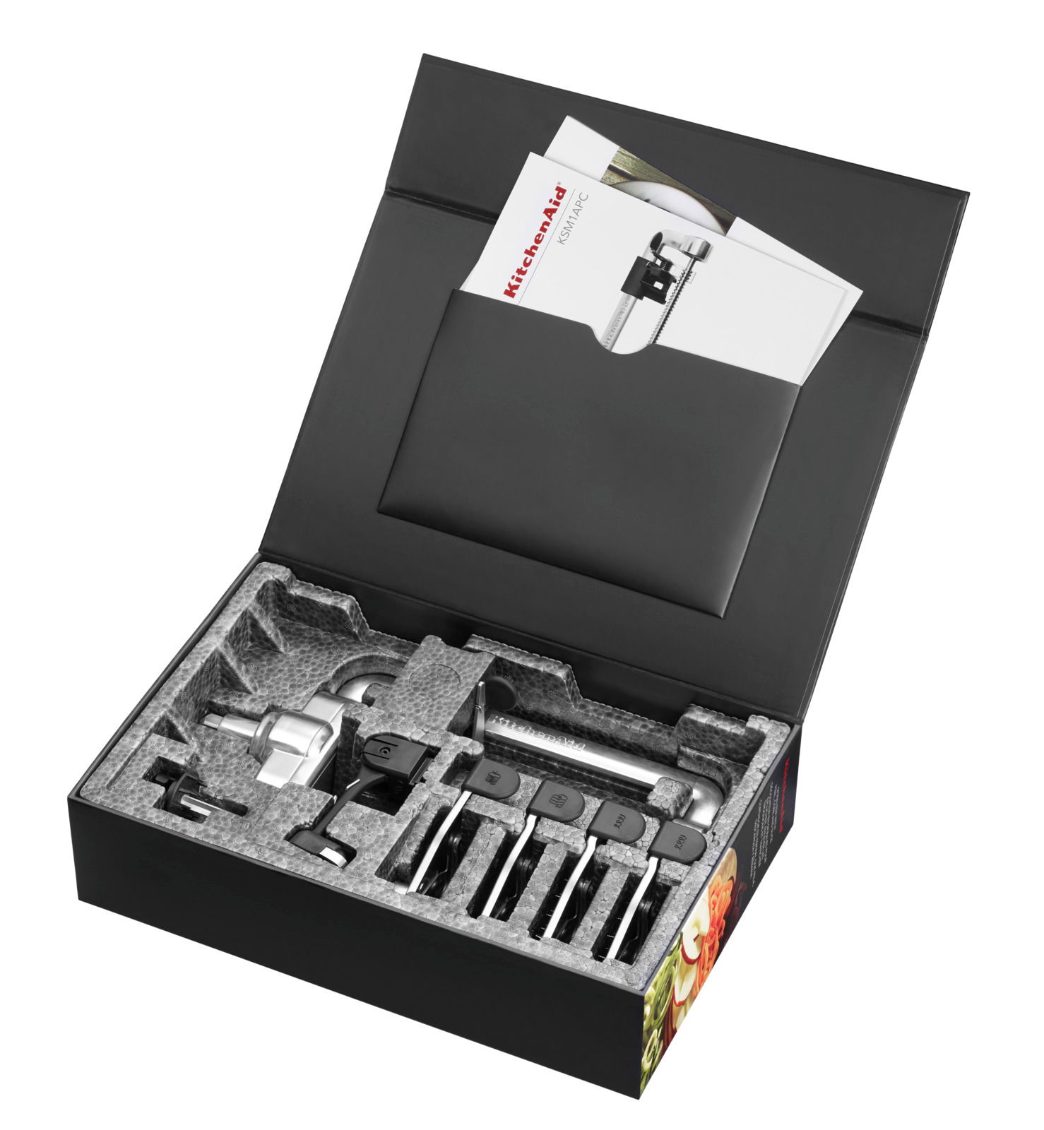 Spiralschneider in geöffneter Verpackung mit Zubehör, von oben betrachtet.