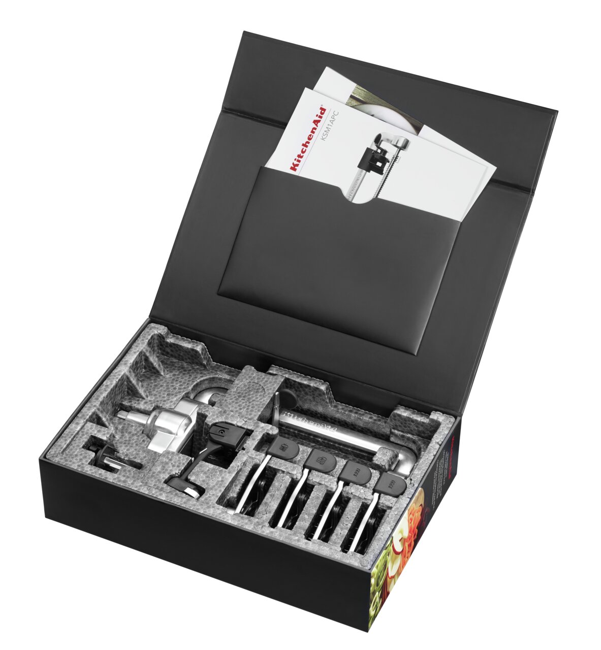 Spiralschneider in geöffneter Verpackung mit Zubehör, von oben betrachtet.