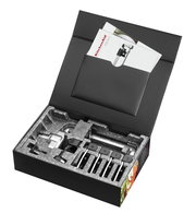 Spiralschneider in geöffneter Verpackung mit Zubehör, von oben betrachtet.