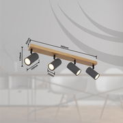 Deckenstrahler aus Metall in Graphit dunkel mit vier verstellbaren Leuchten, montiert auf einer Holzleiste. Perspektive: seitliche Ansicht.